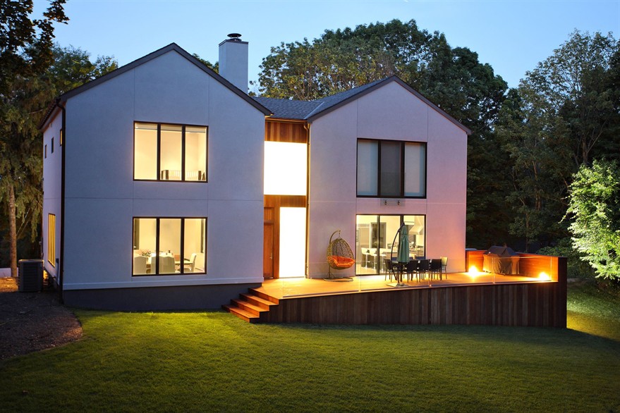 A picture of a modern luxury house and garden